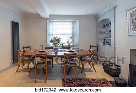 Stock Image - Empty table in dining room. Fotosearch