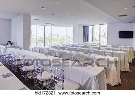 Stock Image - Empty tables in banquet hall. Fotosearch