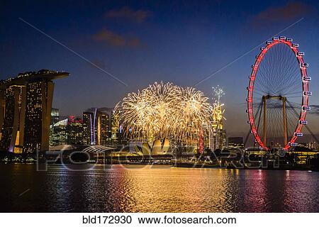 Stock Image - Fireworks over Singapore city skyline, Singapore, Singapore. Fotosearch
