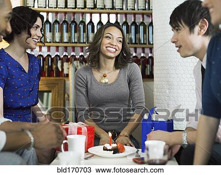 Friends celebrating birthday in restaurant View Large Photo Image Stock Image - Friends celebrating birthday in restaurant. Fotosearch