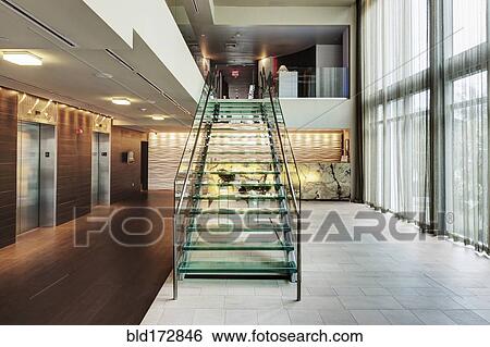 Glass staircase in hotel lobby View Large Photo Image Stock Photograph - Glass staircase in hotel lobby. Fotosearch