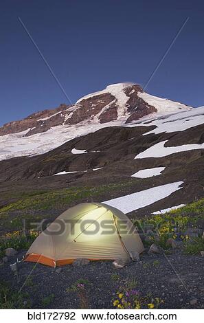 Glowing tent at campsite in remote landscape View Large Photo Image Stock Image - Glowing tent at campsite in remote landscape. Fotosearch