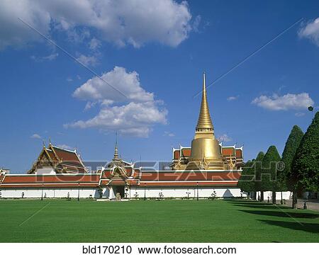 Stock Image - Golden spire of ornate temple, Bangkok, Bangkok, Thailand. Fotosearch