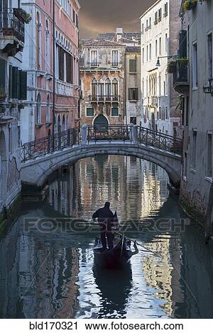 Gondolier sailing on Venice canal, Veneto, Italy View Large Photo Image Stock Image - Gondolier sailing on Venice canal, Veneto, Italy. Fotosearch