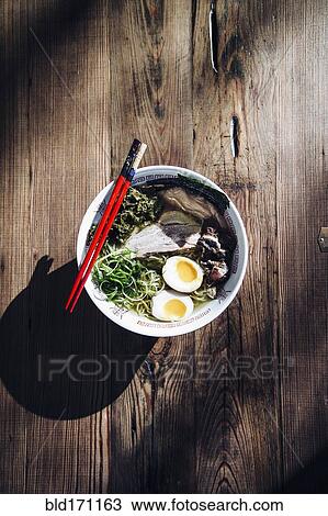 Stock Image - High angle view of bowl of ramen. Fotosearch