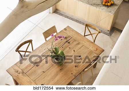 Picture - High angle view of dining table and chairs in kitchen. Fotosearch