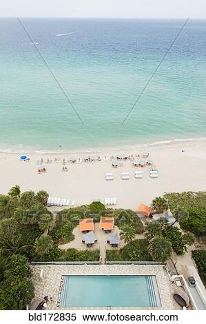 Stock Photography - High angle view of hotel pool and beach. Fotosearch