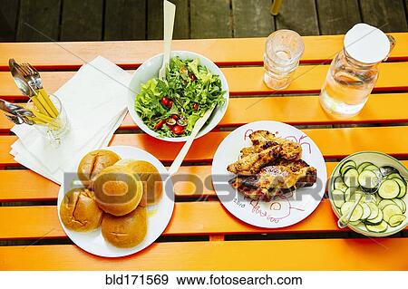 High angle view of salad, meat, cucumbers and salad on table View Large Photo Image Stock Photo - High angle view of salad, meat, cucumbers and salad on table. Fotosearch