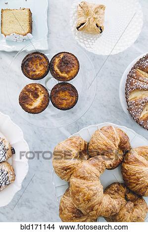 High angle view of variety of pastries on counter View Large Photo Image Picture - High angle view of variety of pastries on counter. Fotosearch