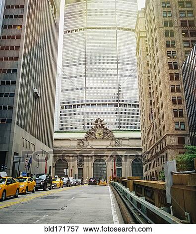 Stock Photo - High rise buildings and taxi cabs on city street, New York City, New York, United States. Fotosearch