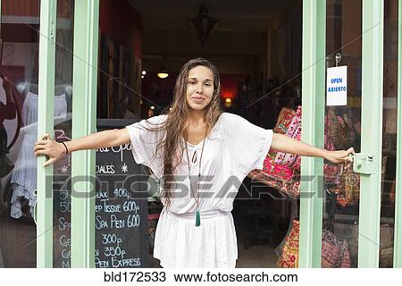 Hispanic business owner opening shop View Large Photo Image Stock Image - Hispanic business owner opening shop. Fotosearch