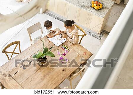 Hispanic mother and son playing game at table View Large Photo Image Stock Image - Hispanic mother and son playing game at table. Fotosearch