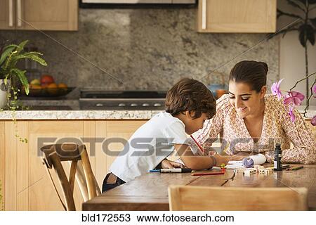 Hispanic mother and son playing game at table View Large Photo Image Stock Image - Hispanic mother and son playing game at table. Fotosearch