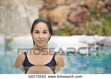 Hispanic woman swimming in pool View Large Photo Image Stock Image - Hispanic woman swimming in pool. Fotosearch