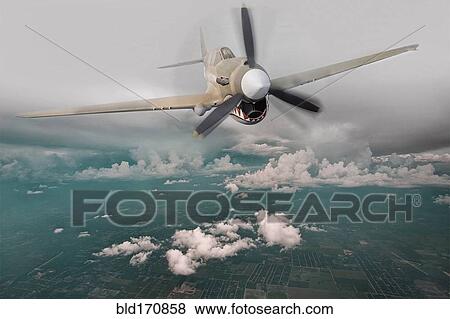 Stock Photo - Historical plane flying in sky. Fotosearch