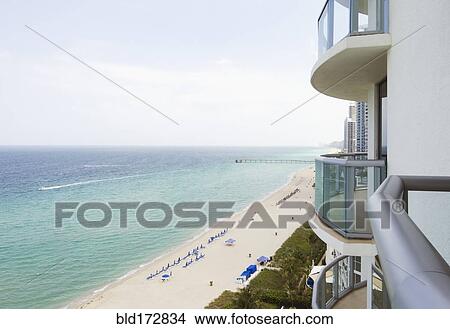 Hotel balcony overlooking urban beach View Large Photo Image Picture - Hotel balcony overlooking urban beach. Fotosearch