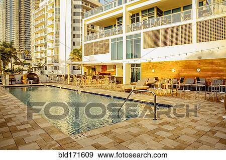 Hotel swimming pool and courtyard View Large Photo Image Stock Photo - Hotel swimming pool and courtyard. Fotosearch