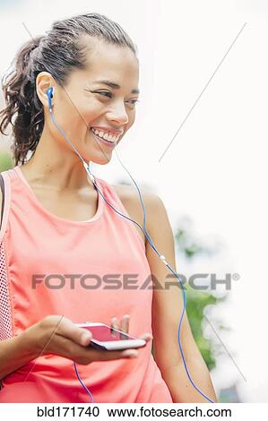 Indian athlete listening to mp3 player View Large Photo Image Stock Image - Indian athlete listening to mp3 player. Fotosearch