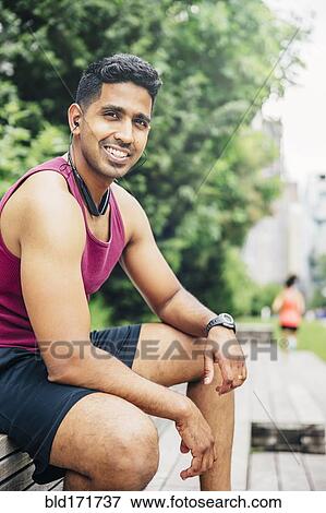 Indian athlete resting in city View Large Photo Image Stock Photo - Indian athlete resting in city. Fotosearch