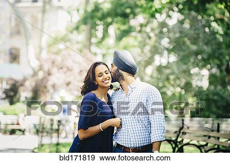 Indian couple kissing in urban park View Large Photo Image Stock Photo - Indian couple kissing in urban park. Fotosearch