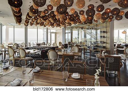 Lanterns over tables in modern restaurant View Large Photo Image Stock Photograph - Lanterns over tables in modern restaurant. Fotosearch