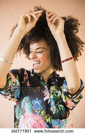 Laughing mixed race woman dancing View Large Photo Image Stock Image - Laughing mixed race woman dancing. Fotosearch