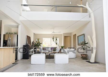 Stock Photo - Living room and balcony in modern home. Fotosearch