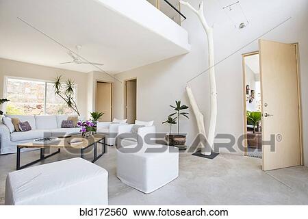 Living room and wall art in modern home View Large Photo Image Stock Image - Living room and wall art in modern home. Fotosearch