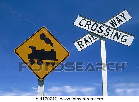 Low angle view of railway crossing signs View Large Photo Image Stock Image - Low angle view of railway crossing signs. Fotosearch