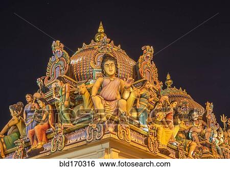 Low angle view of statues on ornate temple dome View Large Photo Image Stock Photograph - Low angle view of statues on ornate temple dome. Fotosearch