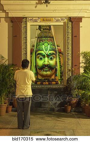 Man admiring statue in ornate temple View Large Photo Image Stock Photography - Man admiring statue in ornate temple. Fotosearch