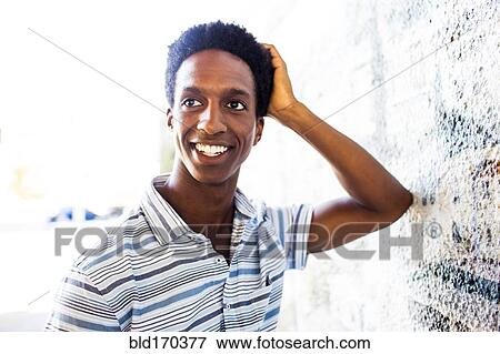 Man smiling by mural wall View Large Photo Image Stock Photo - Man smiling by mural wall. Fotosearch