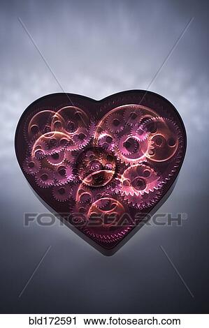 Mechanical gears turning in heart shape View Large Photo Image Stock Image - Mechanical gears turning in heart shape. Fotosearch