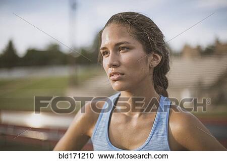 Stock Image - Mixed race athlete on sports field. Fotosearch