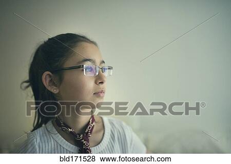 Mixed race girl in eyeglasses looking sideways View Large Photo Image Stock Photo - Mixed race girl in eyeglasses looking sideways. Fotosearch