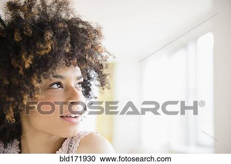 Mixed race woman looking up View Large Photo Image Stock Image - Mixed race woman looking up. Fotosearch