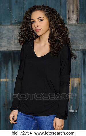 Mixed race woman standing outdoors View Large Photo Image Picture - Mixed race woman standing outdoors. Fotosearch