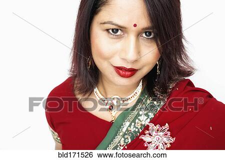 Mixed race woman wearing traditional sari View Large Photo Image Stock Photograph - Mixed race woman wearing traditional sari. Fotosearch