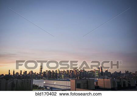 New York city skyline under sunset, New York, United States View Large Photo Image Stock Image - New York city skyline under sunset, New York, United States. Fotosearch