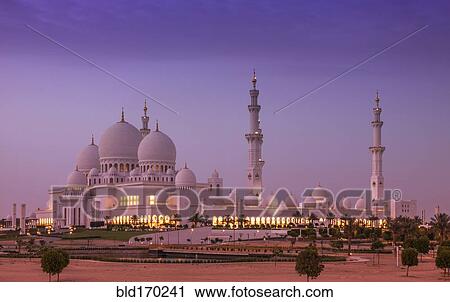Stock Image - Ornate domed building over cityscape, Abu Dhabi, Abu Dhabi Emirate, United Arab Emirates. Fotosearch