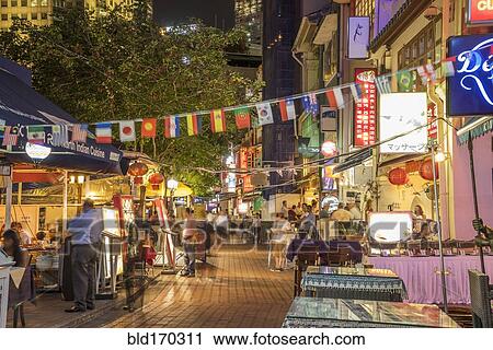 Stock Image - Outdoor vendors on Singapore sidewalk, Singapore, Singapore. Fotosearch