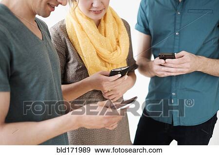 People using cell phones View Large Photo Image Stock Photo - People using cell phones. Fotosearch