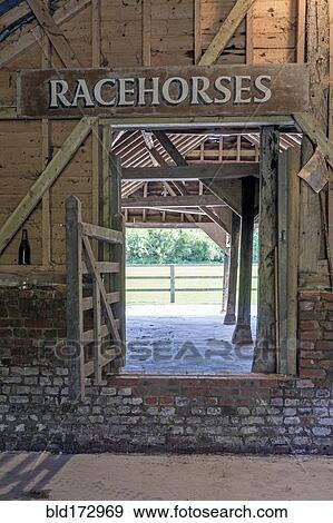 Stock Photo - Racehorse sign over farm stable. Fotosearch