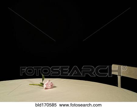 Stock Photography - Rose on empty table. Fotosearch