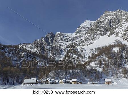 Rural village under snowy mountains View Large Photo Image Stock Image - Rural village under snowy mountains. Fotosearch