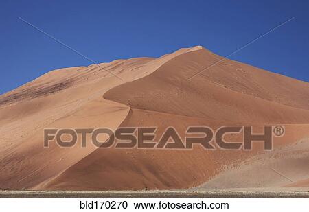 Stock Image - Sand dunes in desert landscape. Fotosearch