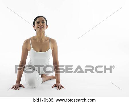 Serene woman practicing yoga View Large Photo Image Stock Image - Serene woman practicing yoga. Fotosearch