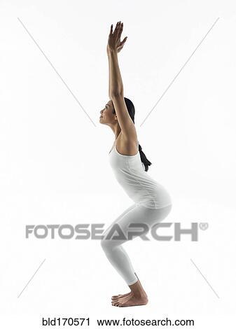 Serene woman practicing yoga View Large Photo Image Stock Image - Serene woman practicing yoga. Fotosearch