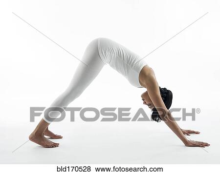 Serene woman practicing yoga View Large Photo Image Stock Photo - Serene woman practicing yoga. Fotosearch