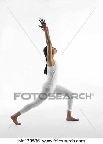 Serene woman practicing yoga View Large Photo Image Stock Photograph - Serene woman practicing yoga. Fotosearch
